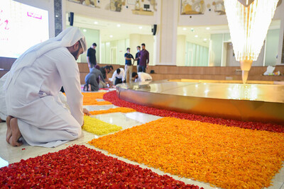 burjeel-arab-staff-arranging-floral-carpet-pookalam-ePathram